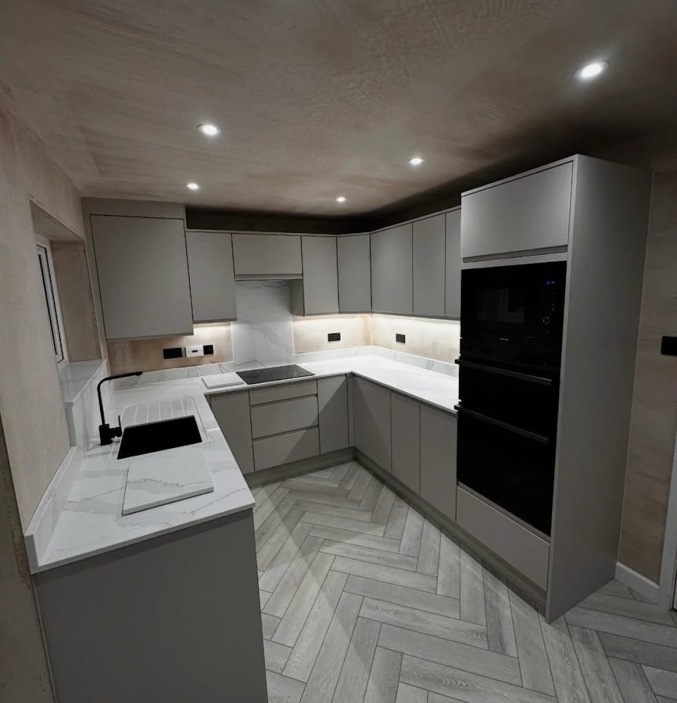 Grey kitchen with a freshly skimmed ceiling and spotlights